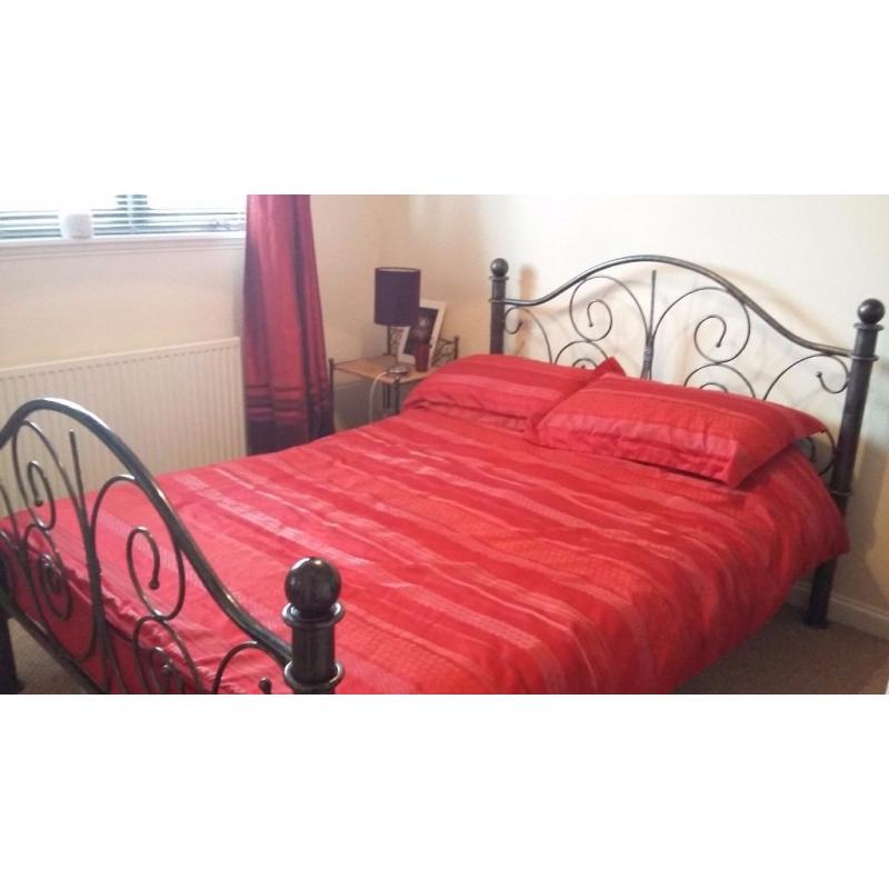 Cast iron double bed with two matching bed side cabinets