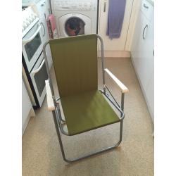 2 green folding chairs